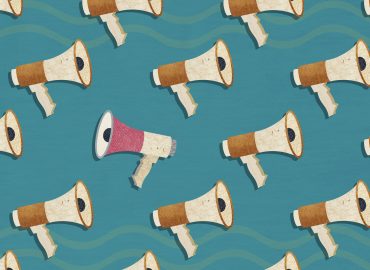 A pattern of megaphones with one megaphone facing in the opposite direction to the rest. A Composite image made of photographic textures and drawn elements